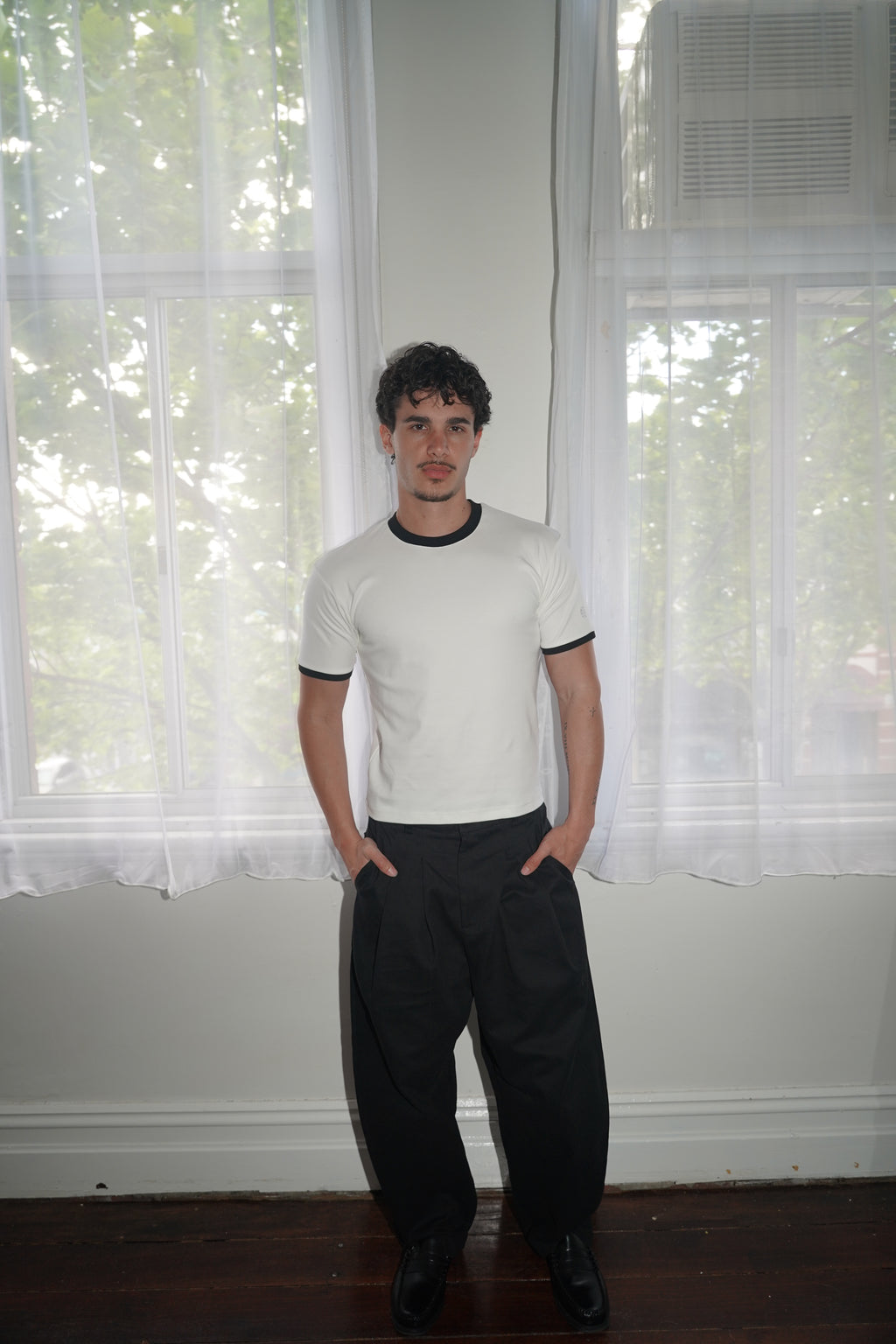 pleated pants — black