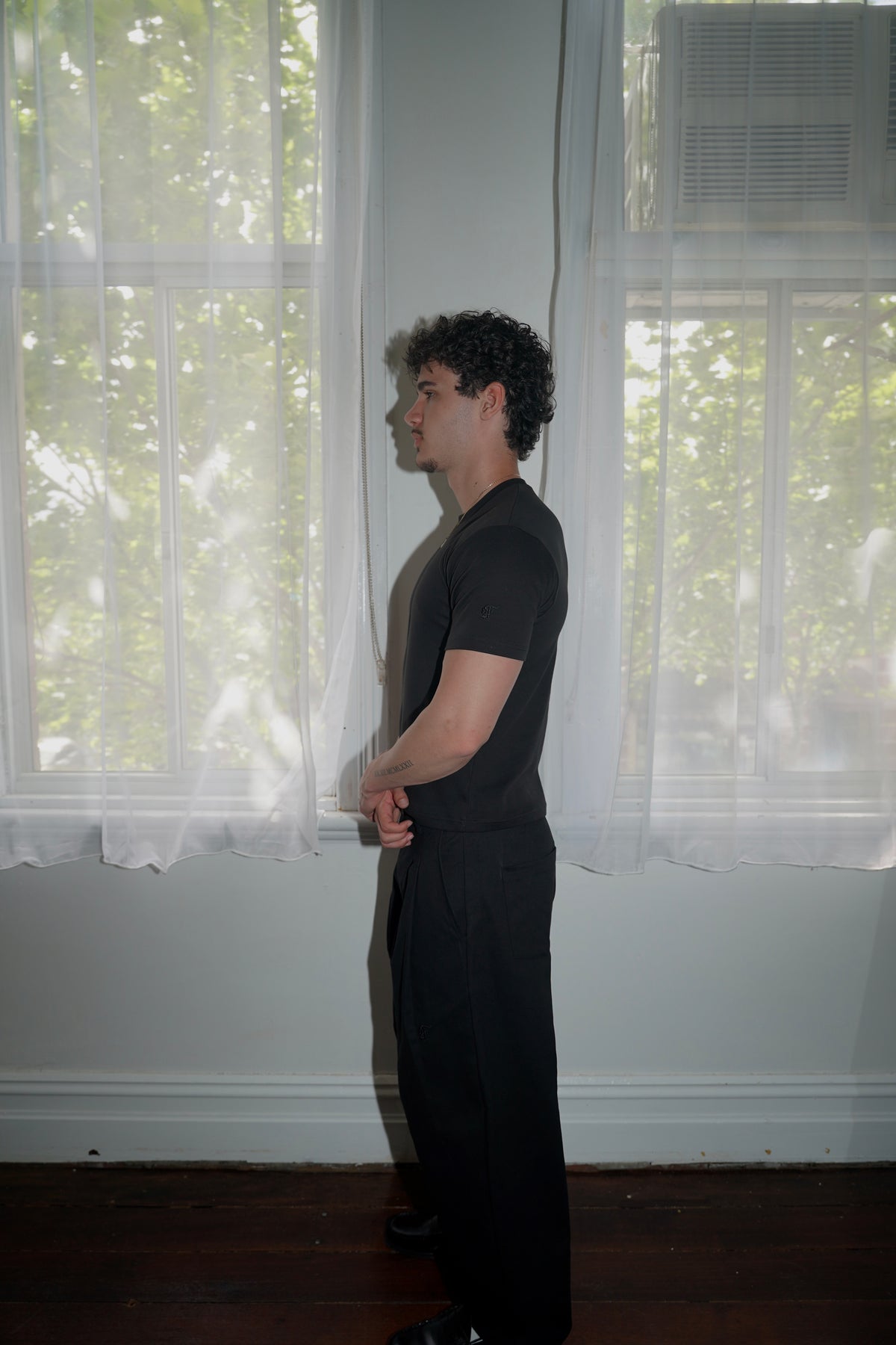 pleated pants — black