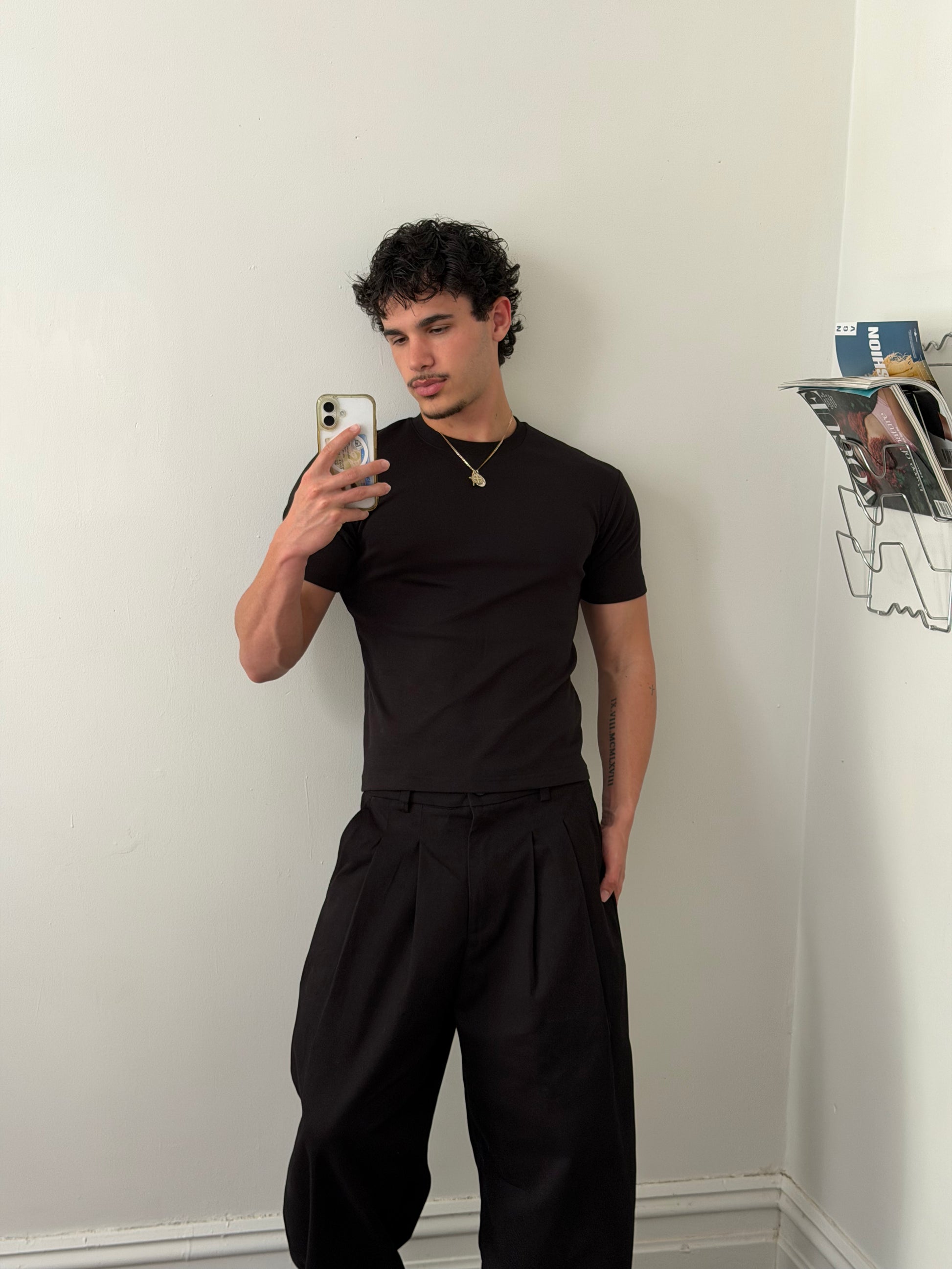 pleated pants — black